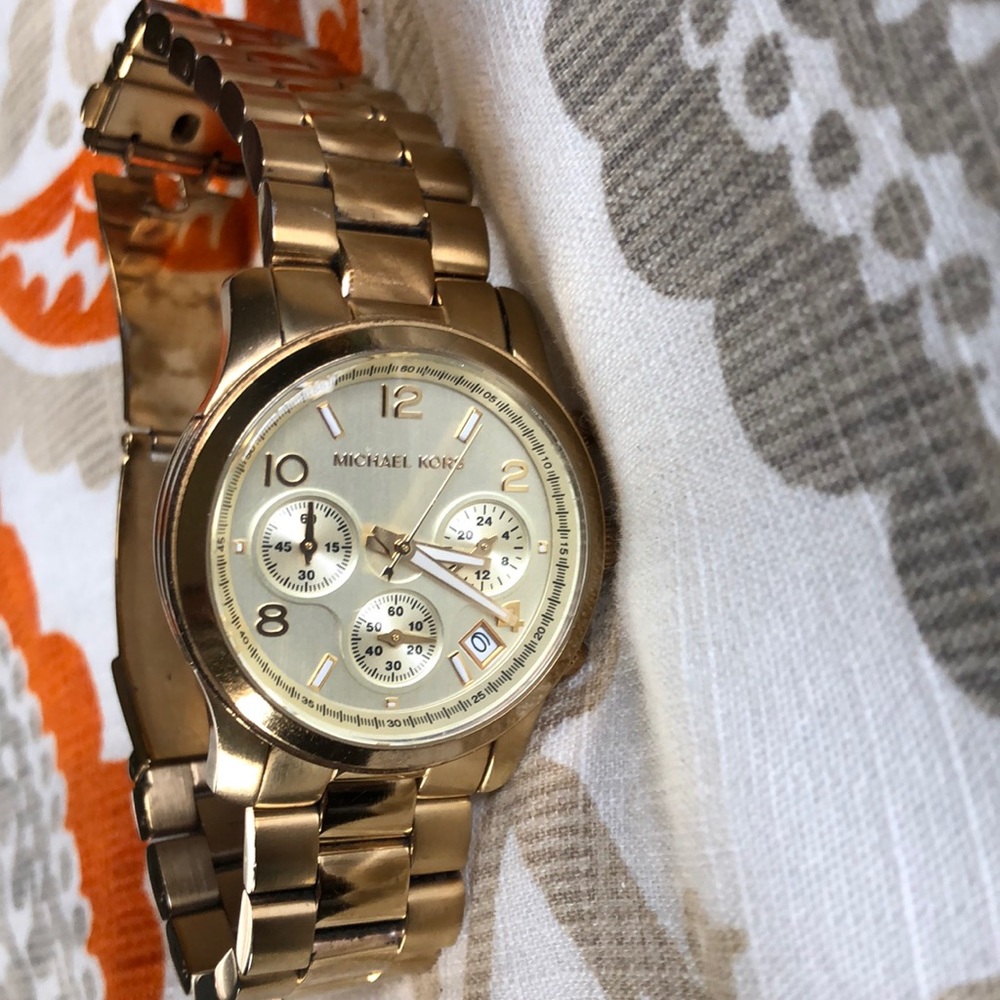 Gold plated stainless steel chronograph watch.